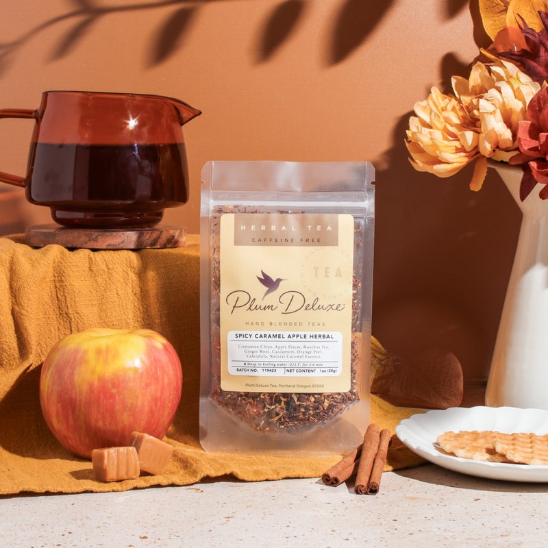 Plum Deluxe Spicy Caramel Apple herbal tea with apples and fall flowers